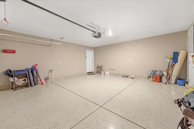 a room with gym equipment and view of living room