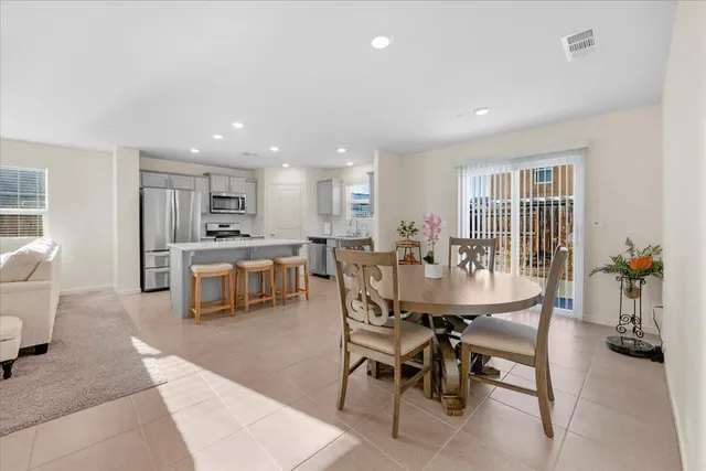 a dining room with furniture and window