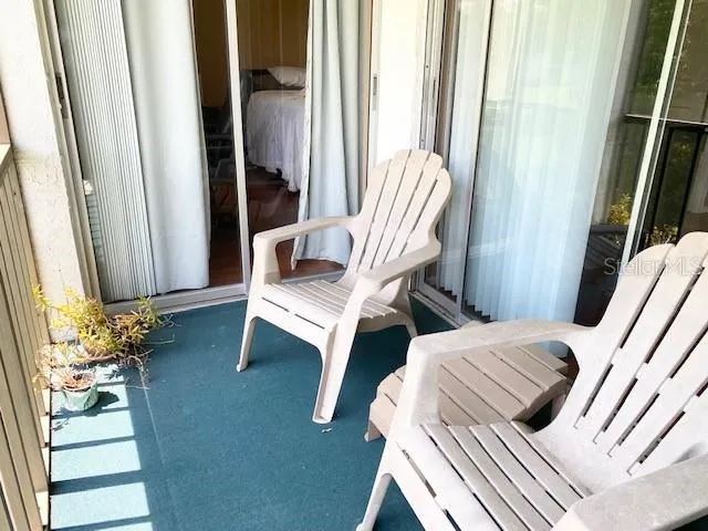 a view of a swimming pool with a yard