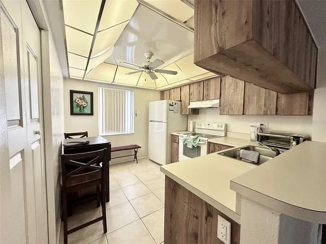 a kitchen that has a cabinets and a stove