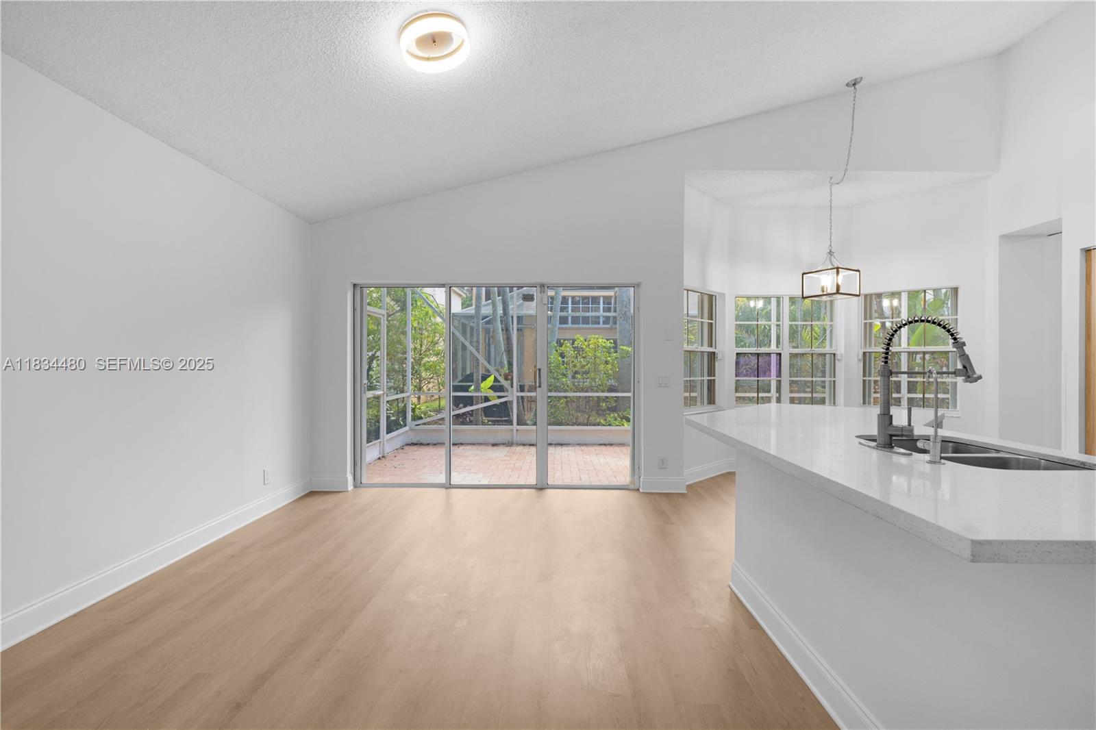 1525 Seabay Road Weston, FL 33326 - Photo 12 of 29 a view of a kitchen and a sink wooden floor
