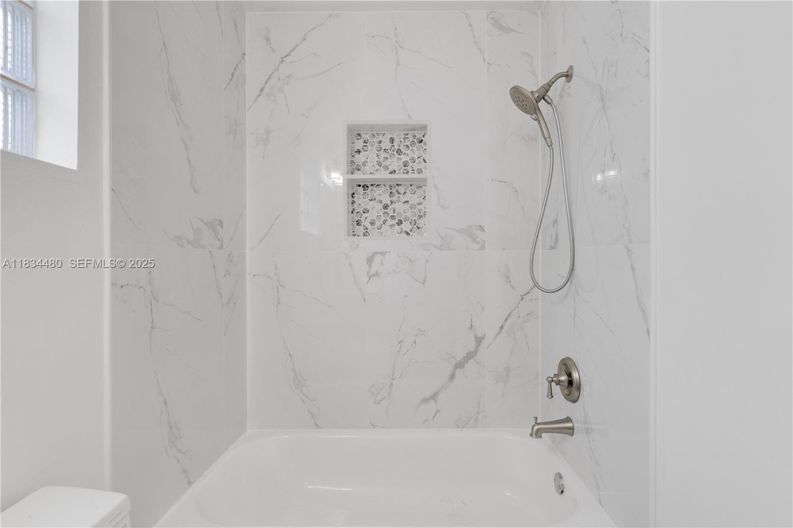 1525 Seabay Road Weston, FL 33326 - Photo 18 of 29 a bathroom with a shower
