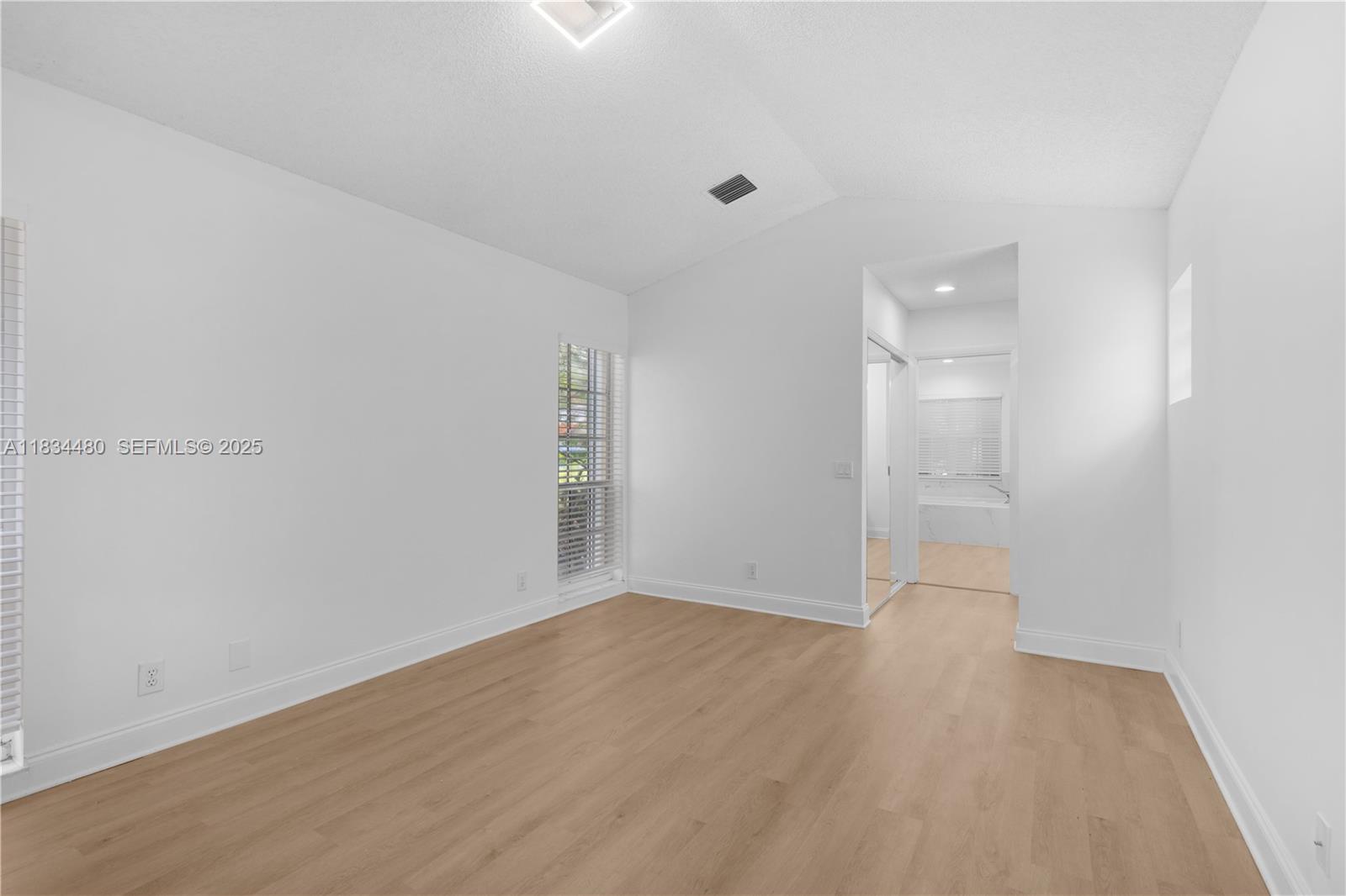 1525 Seabay Road Weston, FL 33326 - Photo 23 of 29 wooden floor in an empty room