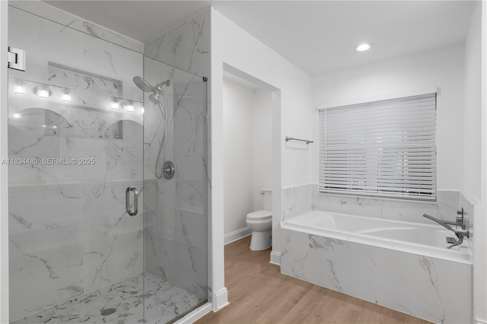 1525 Seabay Road Weston, FL 33326 - Photo 28 of 29 a bathroom with a bathtub and a shower