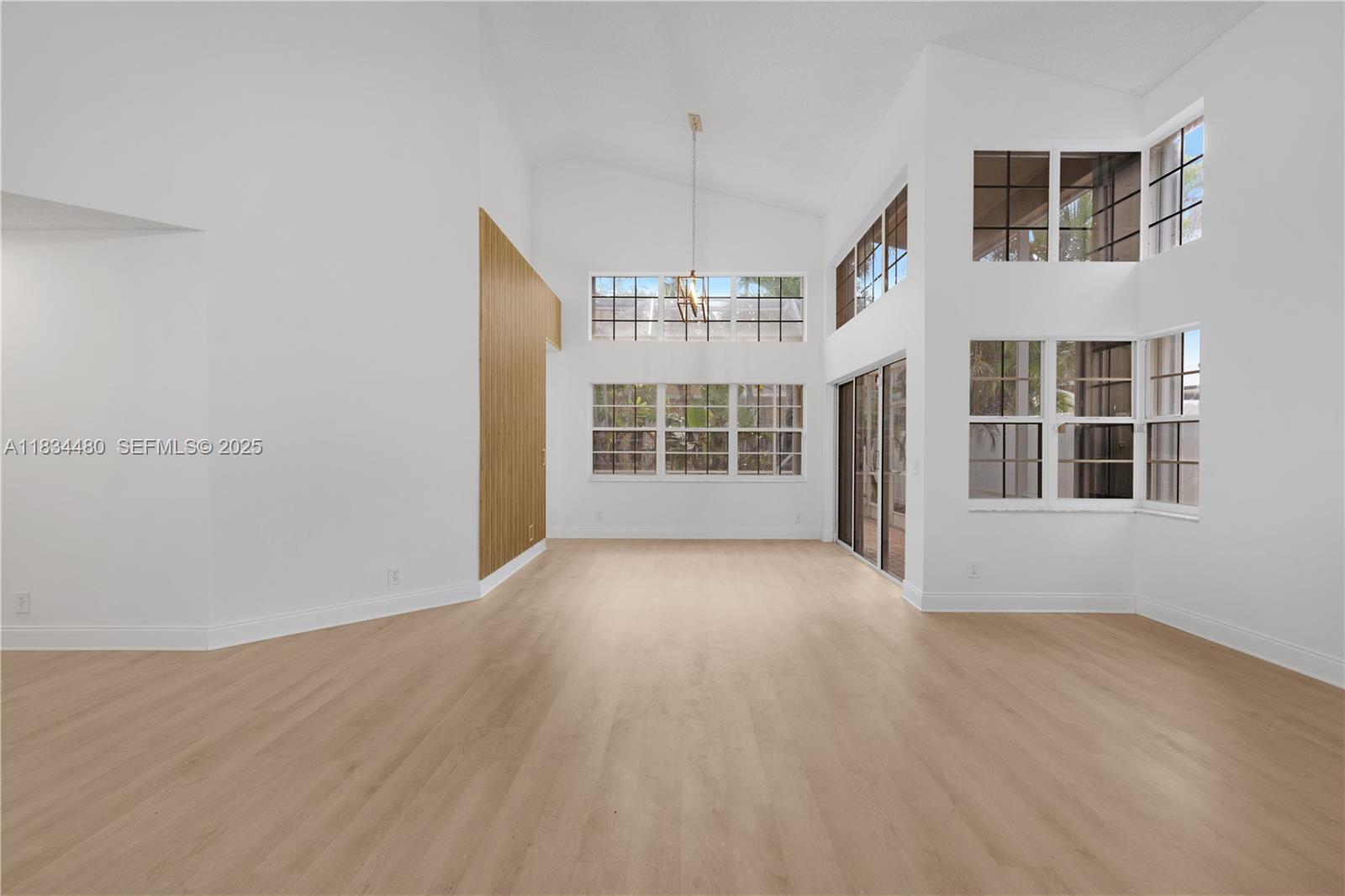 1525 Seabay Road Weston, FL 33326 - Photo 3 of 29 a view of an empty room with a window