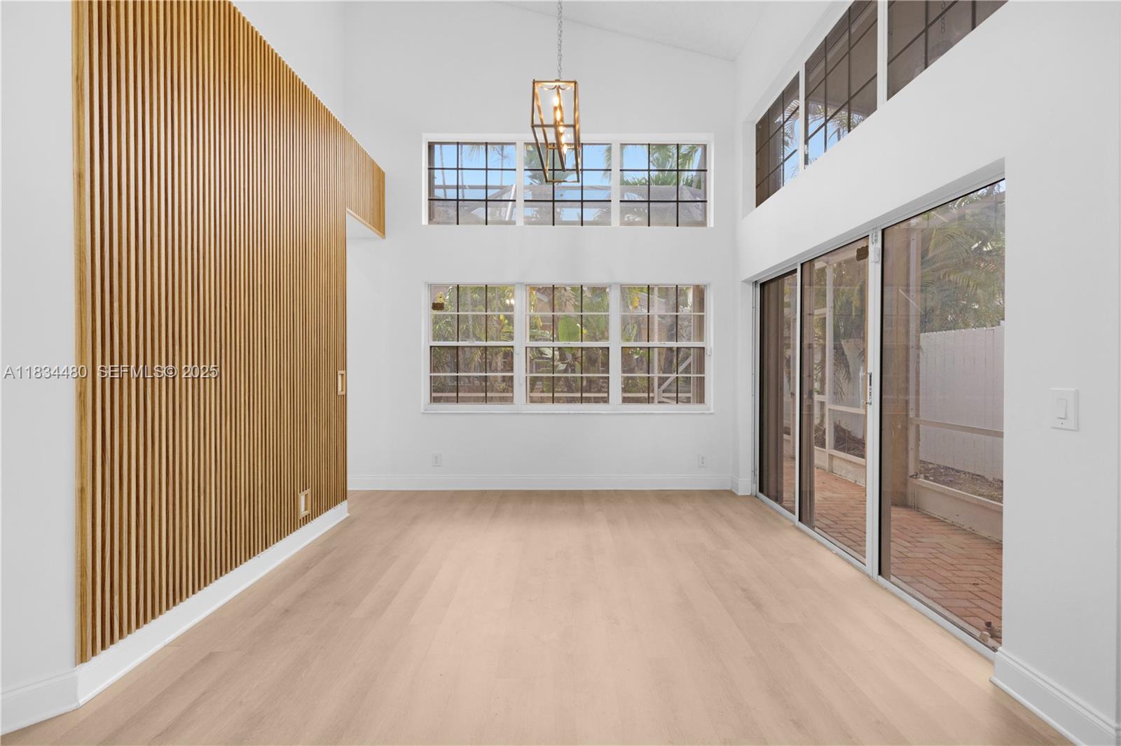 1525 Seabay Road Weston, FL 33326 - Photo 5 of 29 a view of an empty room with a window