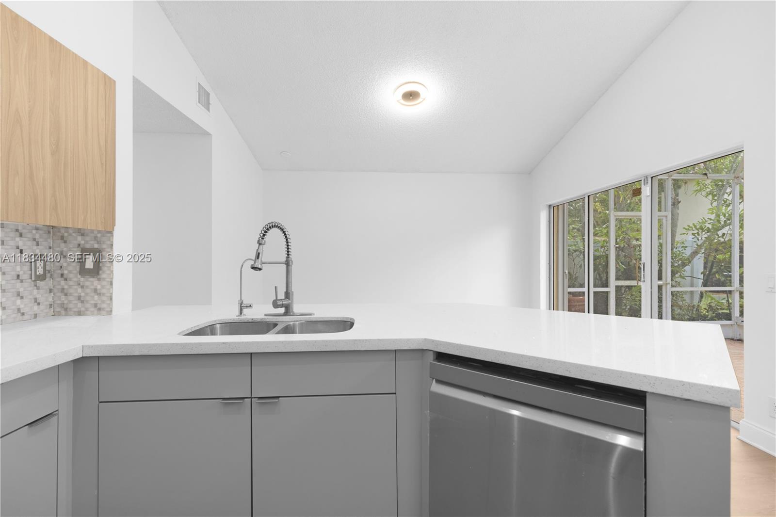 1525 Seabay Road Weston, FL 33326 - Photo 9 of 29 a sink with a window