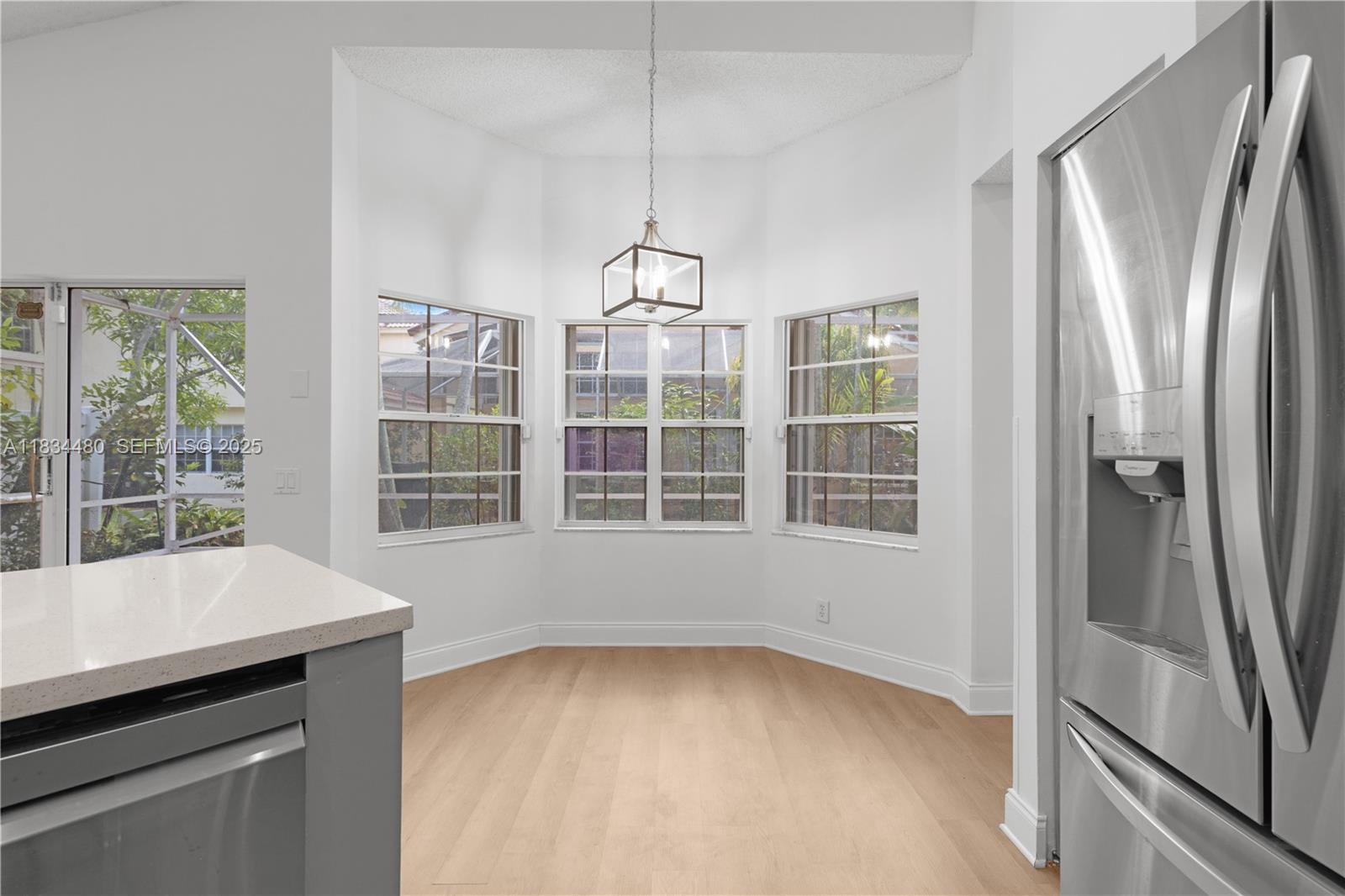 1525 Seabay Road Weston, FL 33326 - Photo 10 of 29 a view of an empty room with a window