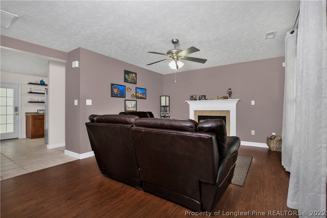 165 Pender Road Spring Lake, NC 28390 - Photo 8 of 33 a living room with furniture and a fireplace