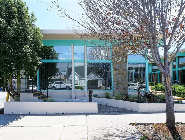 a view of a house with sitting area and garden