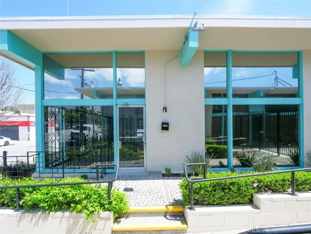 a view of a house with a yard and a glass door