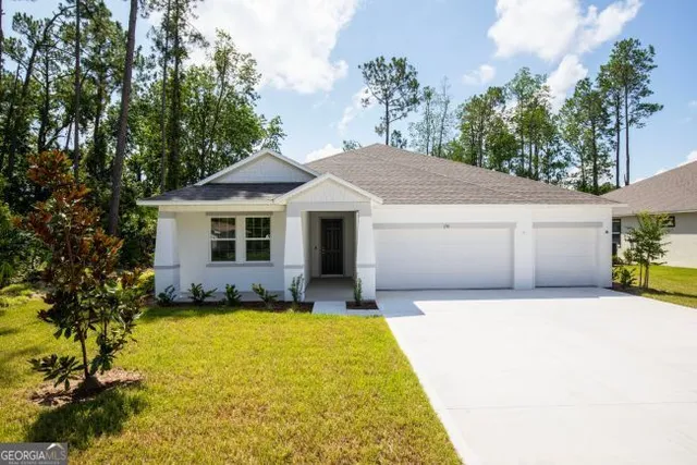 a front view of a house with yard outdoor seating and yard