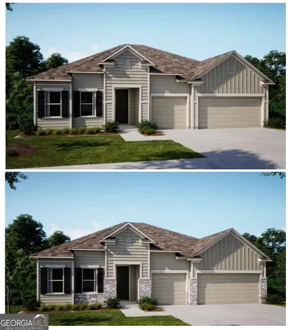 a front view of a house with yard and green space