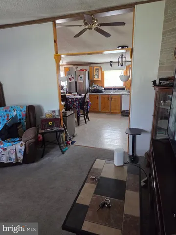 a living room with lots of furniture and a window