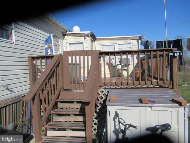 a view of a balcony with furniture and stairs