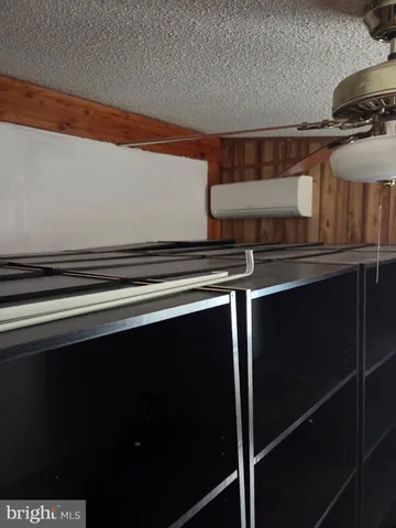 a kitchen that has a lot of cabinets in it and wooden floors