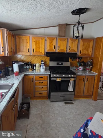 a living room with furniture and a book shelf