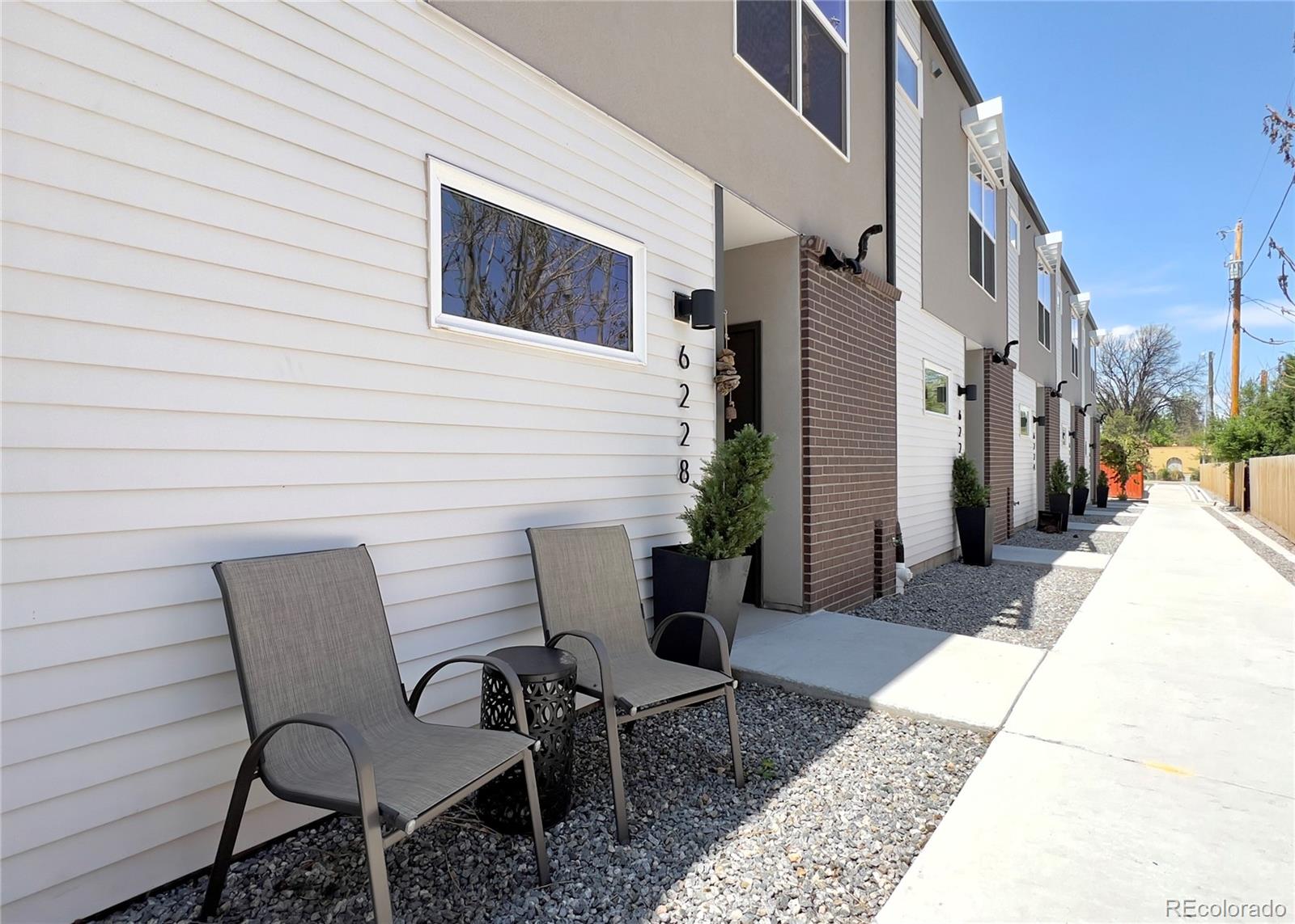 6228 West 38th Avenue Wheat Ridge, CO 80033 - Photo 2 of 38 a view of a patio with a table and chairs
