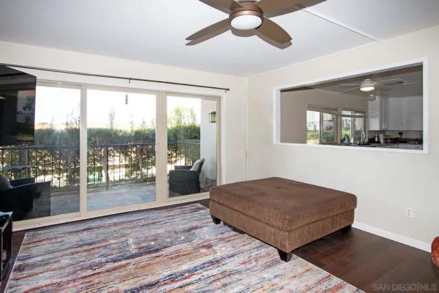 a bedroom with a bed and glass door