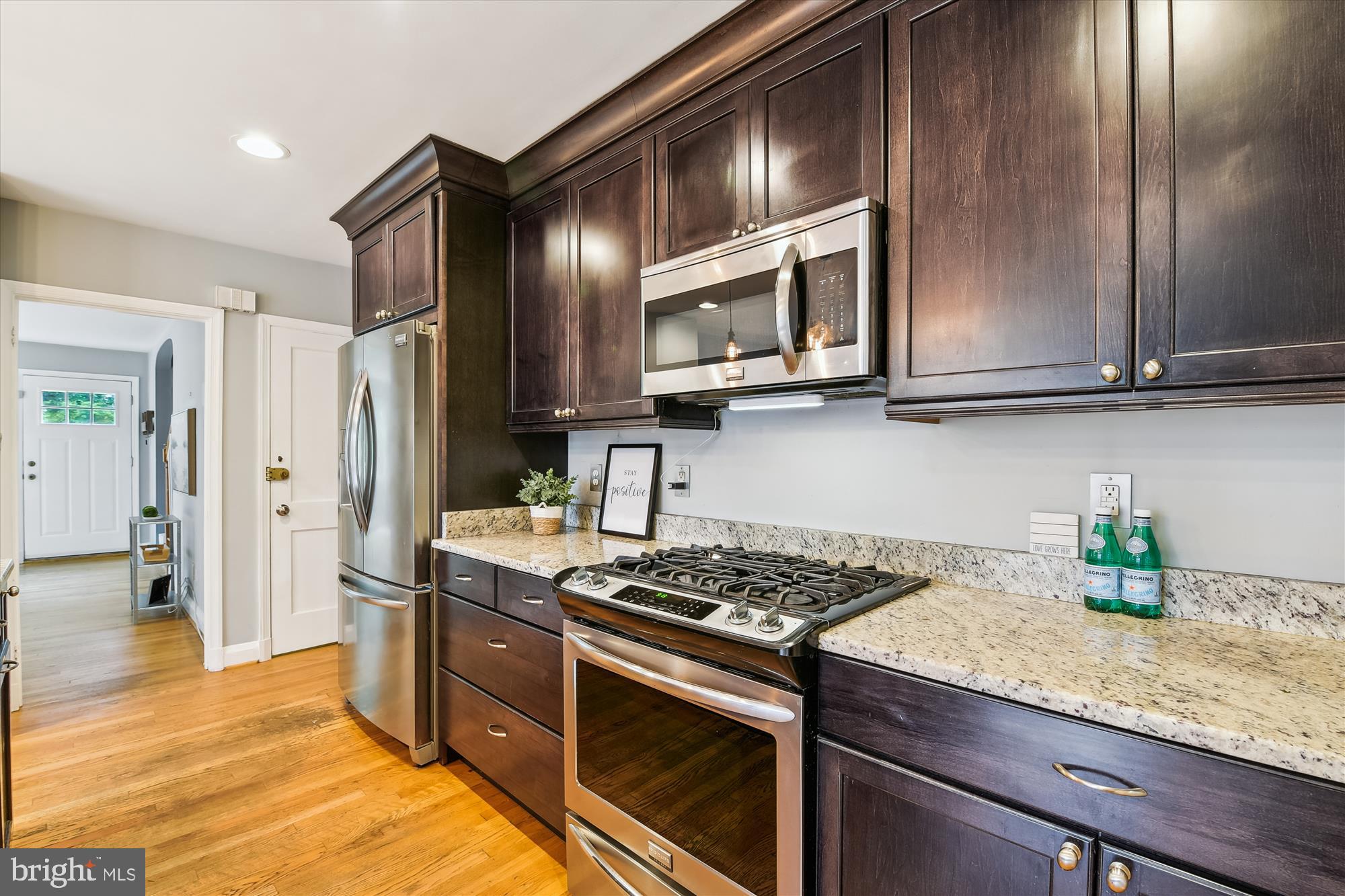 130 Stanmore Road Baltimore, MD 21212 - Photo 15 of 70 a kitchen with stainless steel appliances granite countertop a stove a refrigerator and a microwave