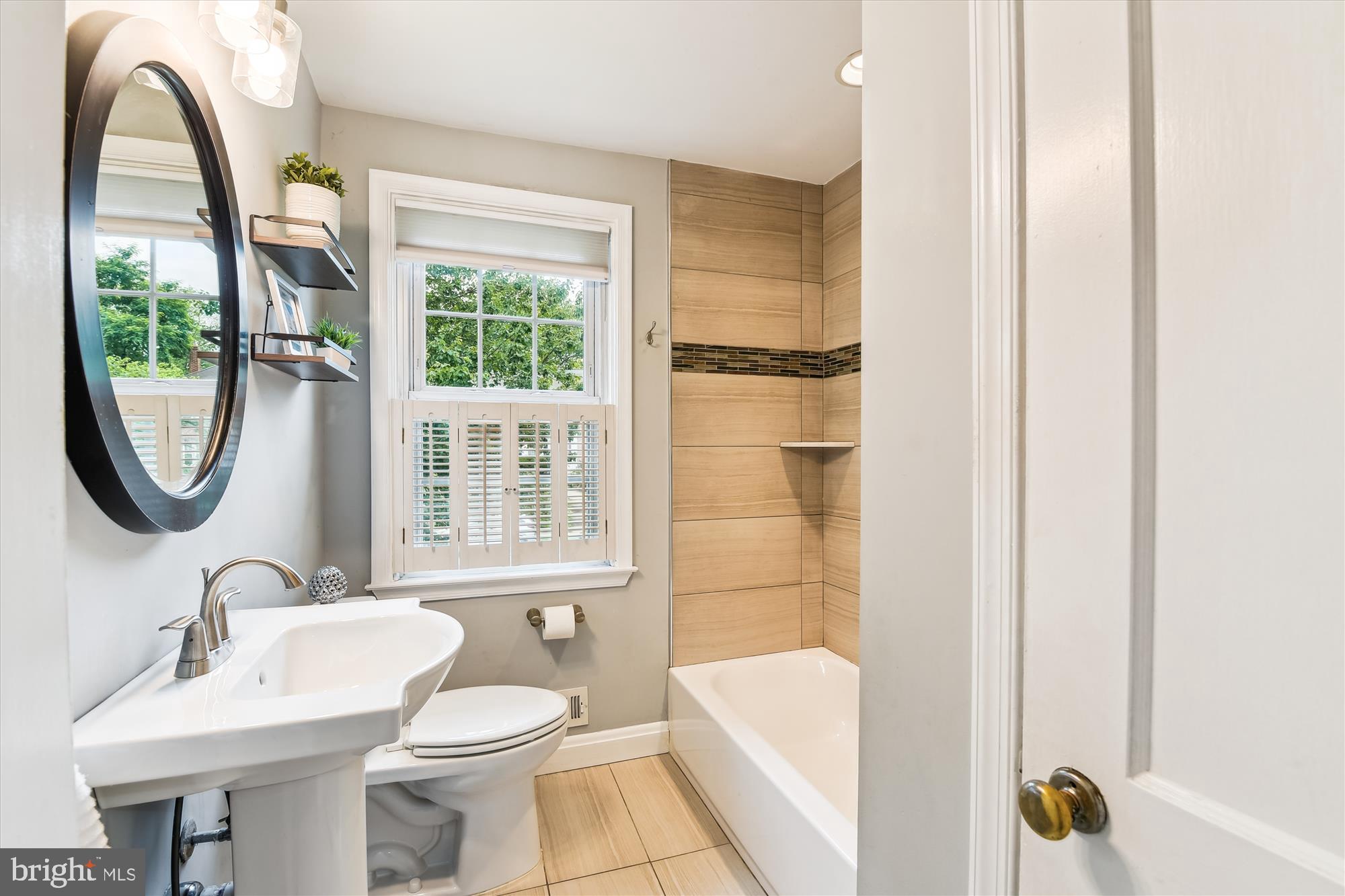 130 Stanmore Road Baltimore, MD 21212 - Photo 30 of 70 a bathroom with a sink toilet and a mirror
