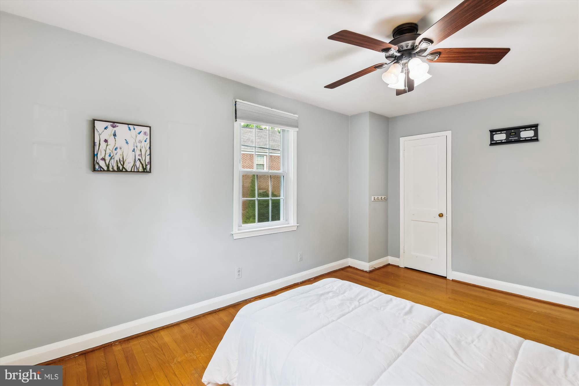 130 Stanmore Road Baltimore, MD 21212 - Photo 33 of 70 a bedroom with a large bed and a chandelier