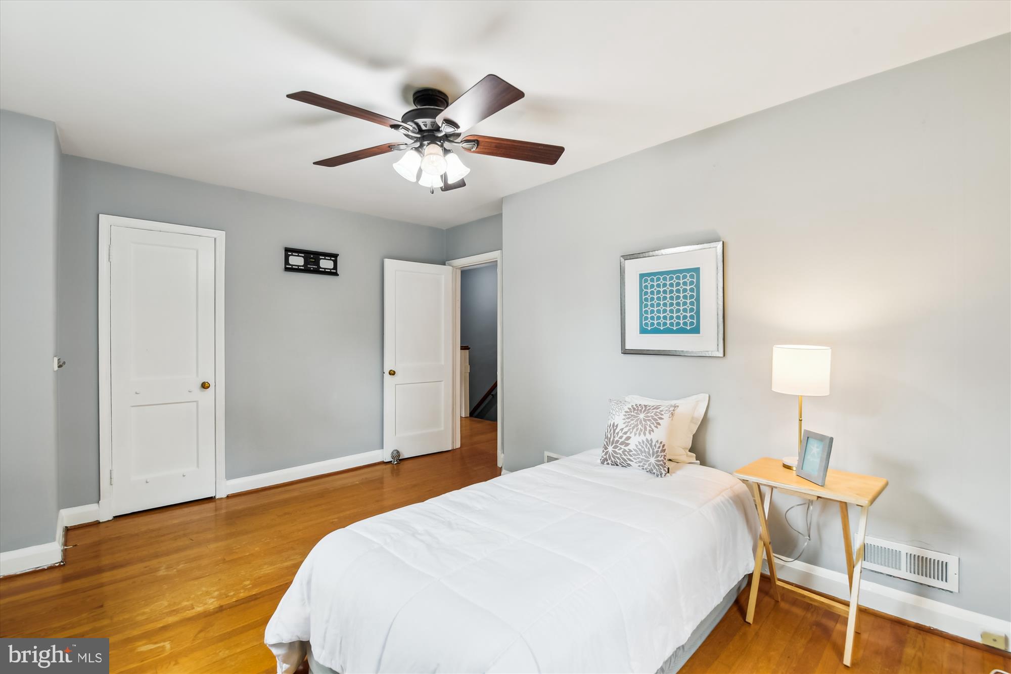 130 Stanmore Road Baltimore, MD 21212 - Photo 34 of 70 a bedroom with a large bed and a chandelier