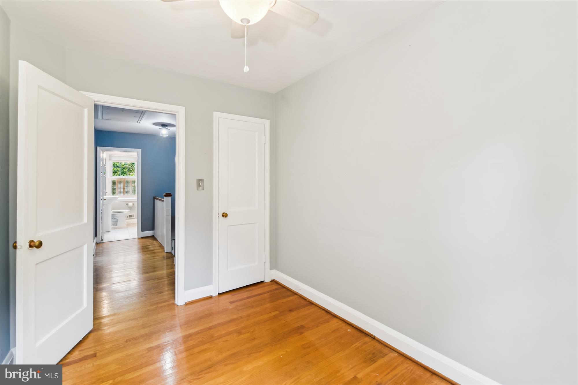 130 Stanmore Road Baltimore, MD 21212 - Photo 37 of 70 a view of a hallway with wooden floor and a bathroom