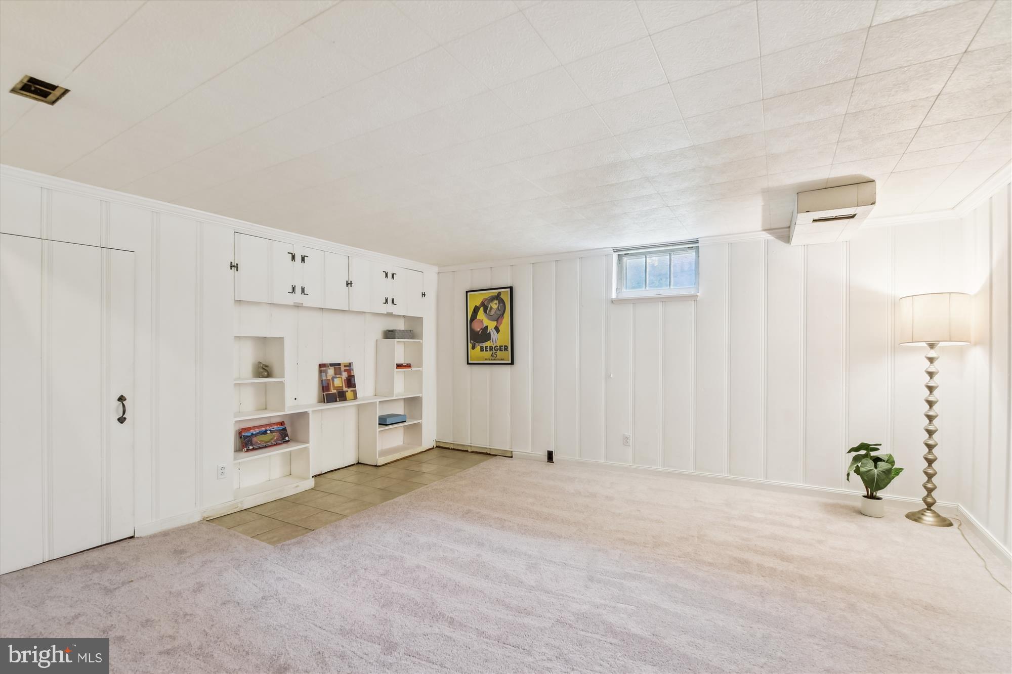 130 Stanmore Road Baltimore, MD 21212 - Photo 41 of 70 REC RM W/ BUILT-IN STORAGE UNIT & PANELED WALLS