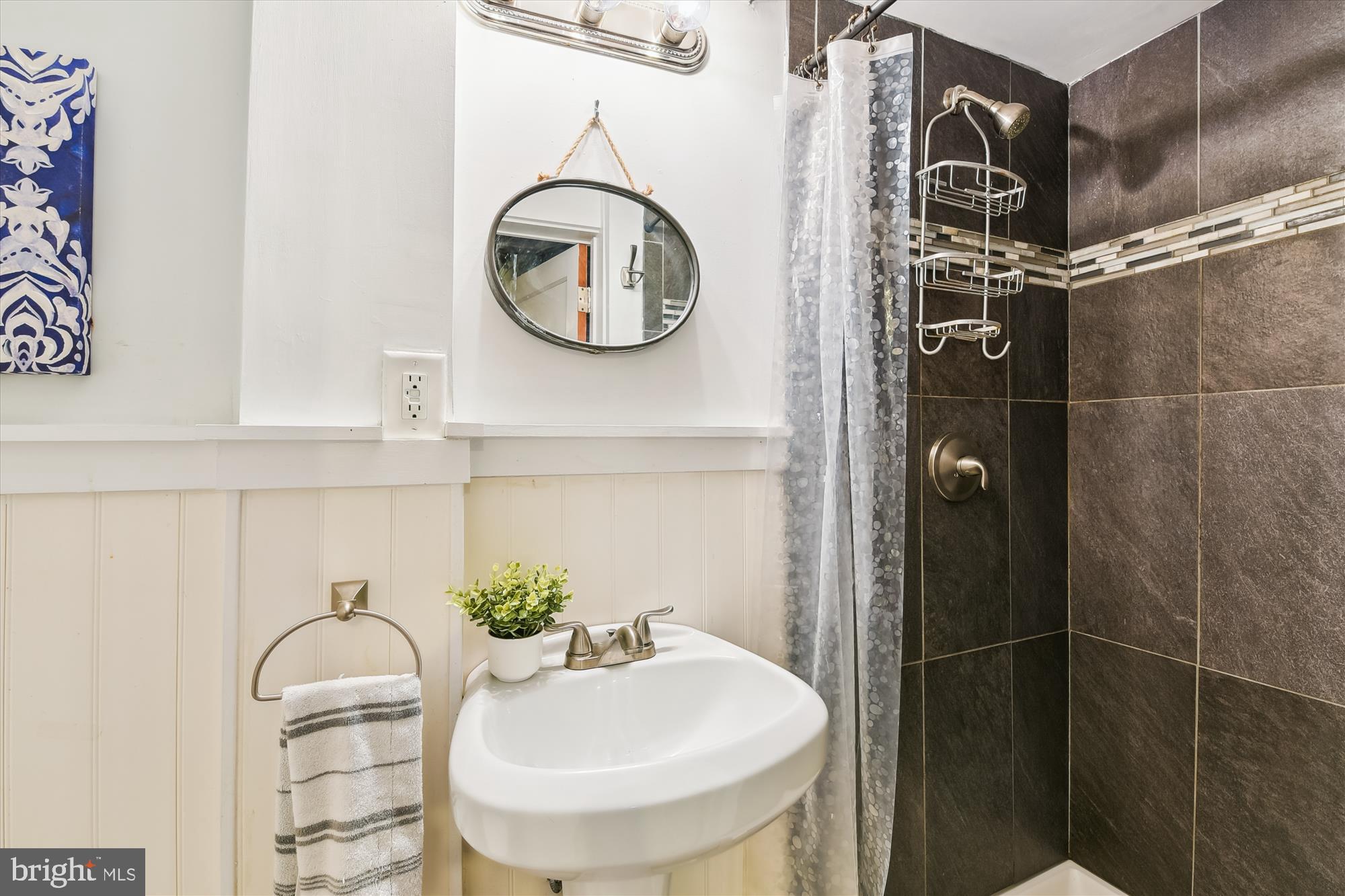 130 Stanmore Road Baltimore, MD 21212 - Photo 50 of 70 a bathroom with a sink and a mirror