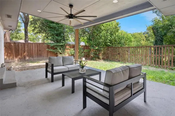 a outdoor living space with furniture and a garden