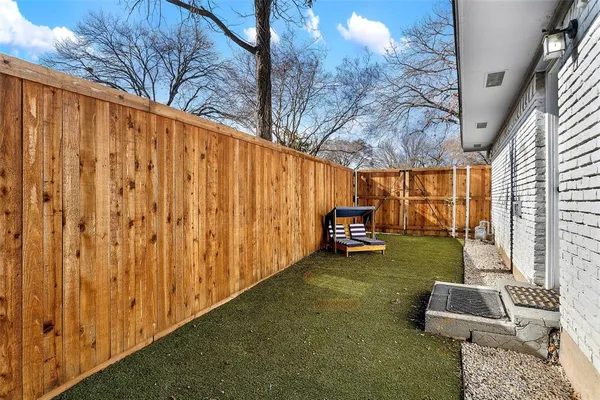 a backyard of a house with seating space