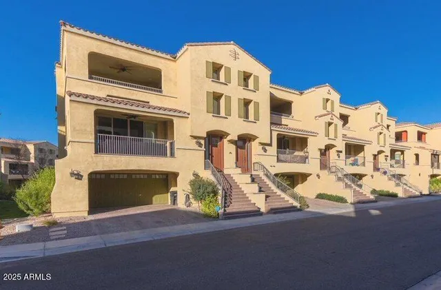 a front view of a building with garage