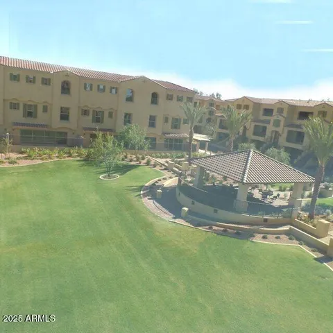 a dining room with furniture and a floor to ceiling window