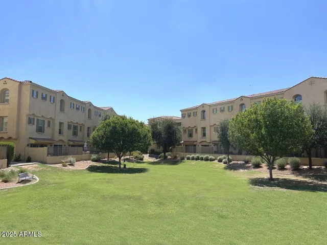 a view of a patio with table and chairs and potted plants