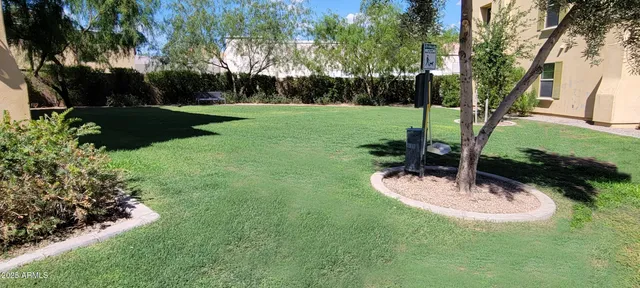 a roof deck with table and chair under an umbrella