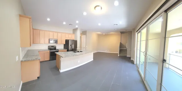 a view of living room with furniture and floor to ceiling window