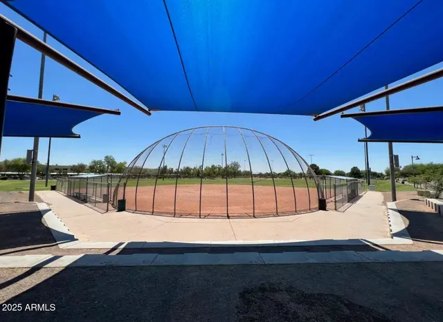 a view of outdoor space with garden and trees