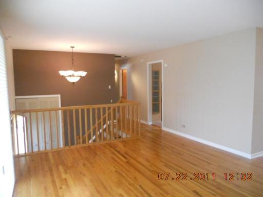 351 North Rohlwing Road Palatine, IL 60074 - Photo 3 of 11 a view of empty room with wooden floor