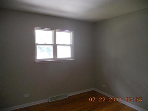 351 North Rohlwing Road Palatine, IL 60074 - Photo 8 of 11 an empty room with a window