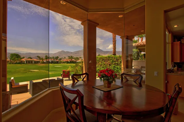 a view of a dining room with furniture window and outside view