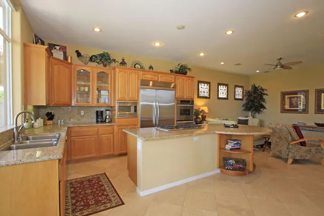 a kitchen with lots of counter top space and appliances