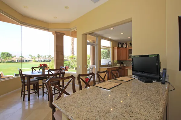 a view of a dining room with furniture window and outside view