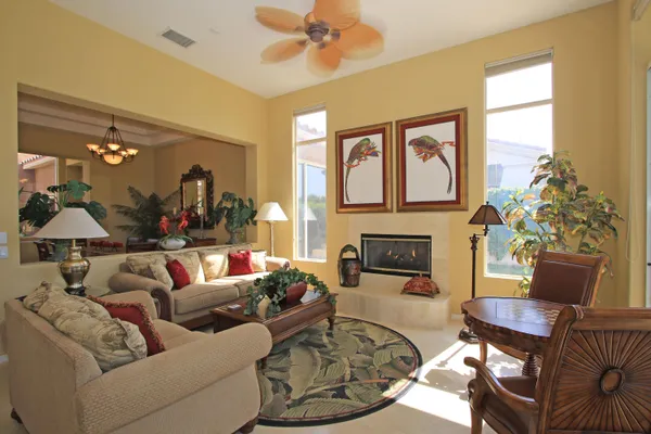 a living room with furniture and a fireplace