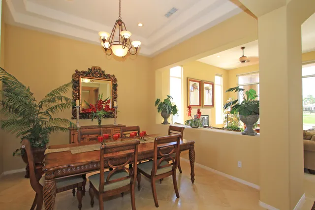 a dining room with furniture and chandelier