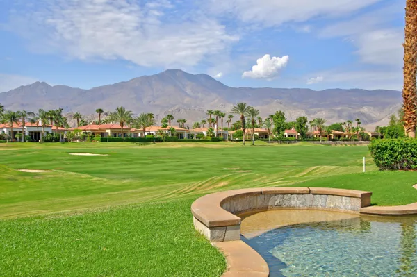 a view of a garden with a large pool