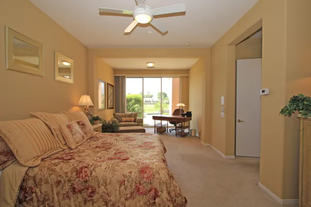 a view of a livingroom with furniture and a flat screen tv
