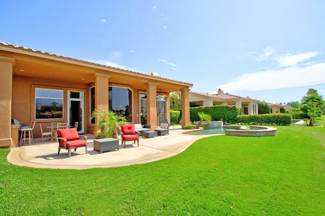 a view of a house with backyard porch and patio