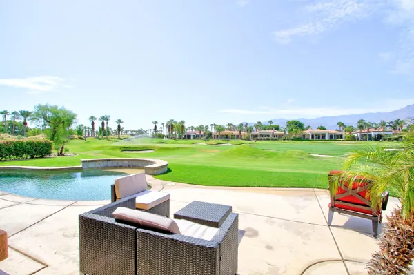 a view of a patio with a big yard