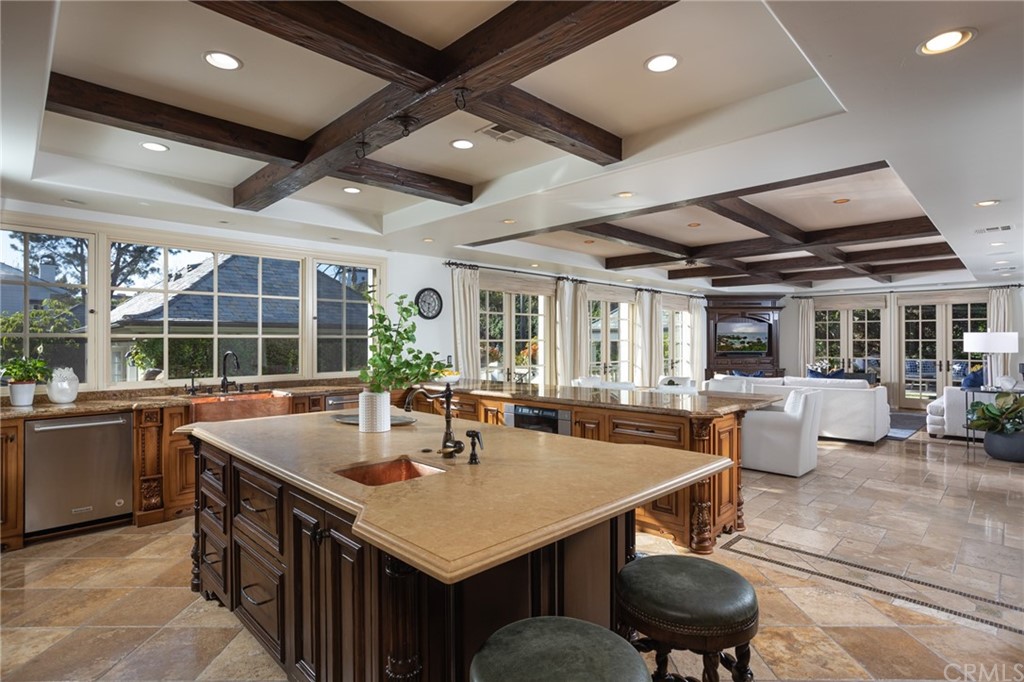 40 Smithcliffs Road Laguna Beach, CA 92651 - Photo 14 of 50 a kitchen with a table chairs and wooden floor
